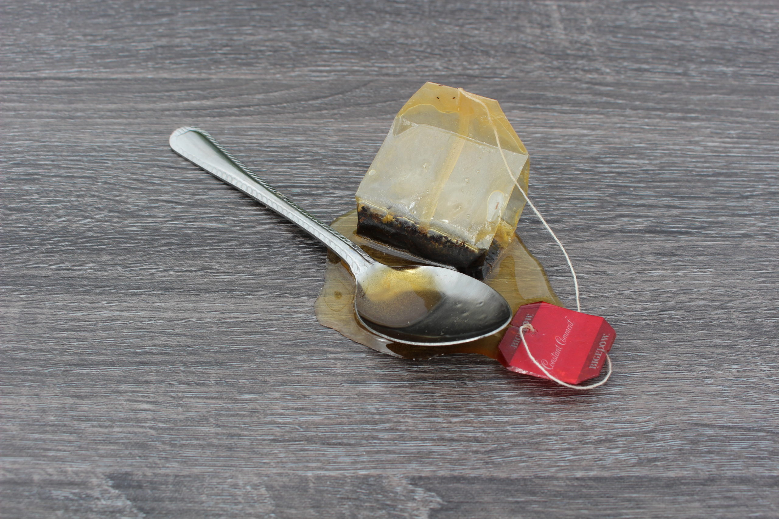 Tea Spoon and Tea Bag in Fake Spill