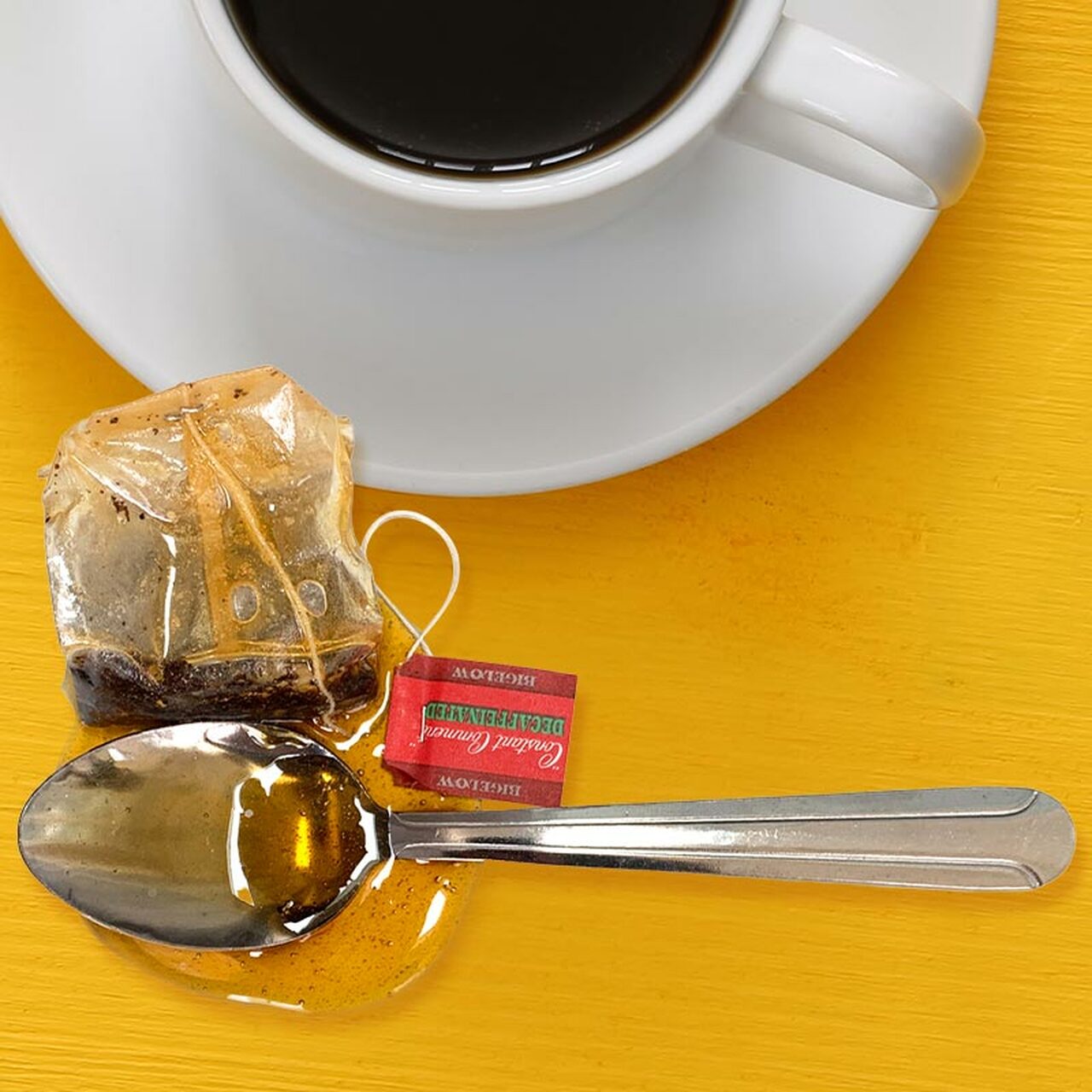 Tea Spoon and Tea Bag in Fake Spill